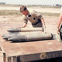 Bob Morgan offloading captured VC ordinance