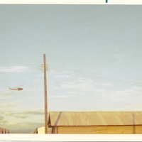 Huey Flying Over Shower