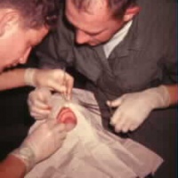 Doc and Bud working on accident victim