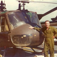 Paul Moore with VNAF UH-1E on LPH Okinawa April 75