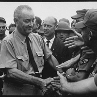 President Lyndon B. Johnson greets American troops