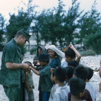 Corpsman giving out vitamins