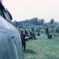Corpsman carrying stretcher to Medevac