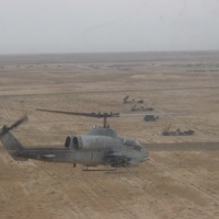 AH-1W Over Patriot Batteries