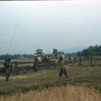 Cap Marines helping civilian booby-trap victim