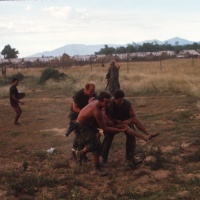 Rushing civilian booby-trap victim to the chopper