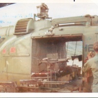 Vmo-6 Crew Chief Cleaning acft in the Field