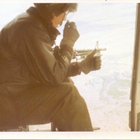 Vmo-6 Gunship Crew Chief Eyes on the Terrain Below