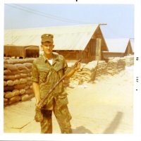 LCpl Chatelain holding a Viet Cong Weapon