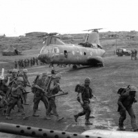 Marines embarking into a CH-46