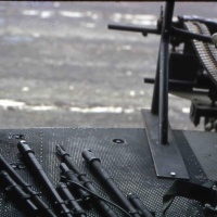 VMO-3 UH-1E Gunship with machine gun barrels on deck...