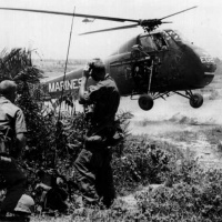 Forward Air Control guiding a UH-34 into a landing zone