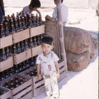 Little Boy Selling Coke in Ville South West of Chu Lai Sept. 1965.