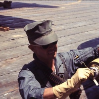 VMA 225 Pilot Lt. Harry Slacum checks fuse on 250 lb. bomb during preflight at Chu Lai