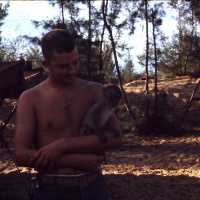 VMA 225 Marine Lt. Dan Yates OIC Holds Squadron Mascot L/Cpl Justin Case at Chu Lai Aug. 1965.
