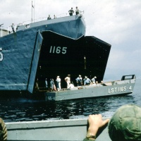 LST 1165 Washoe County picks up VMA 225 Marines in Iwakuni Harbor.