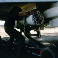 Marines from VMA 225 Ordinance loading Rockets on Wing Station of A4C Aircraft.