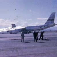 Vietnamese Civilians Sweep for FOD at Danang; U.S. Air Force KC 135 in Backround Oct. 3