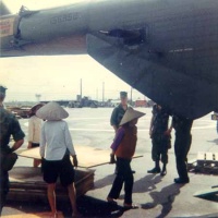 Vietnamese load materials on my aircraft for a nearby Orphanage.