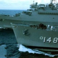 U.S.S. Iwo Jima refueling while under way. Oiler in the middle. LPD-7