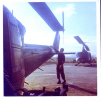 Sgt. Mike Swiatecki Preflighting An HML167 Huey - 1970