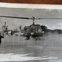 Gene_Day_taxiing_dignitaries_Huey_MMAF_Vietnam.jpg