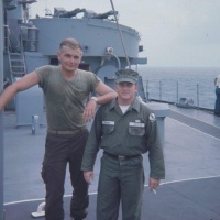 John Young UDT 12 and some skinny fella with a high and tight.