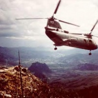 HMM-164 lifting from a mountain top